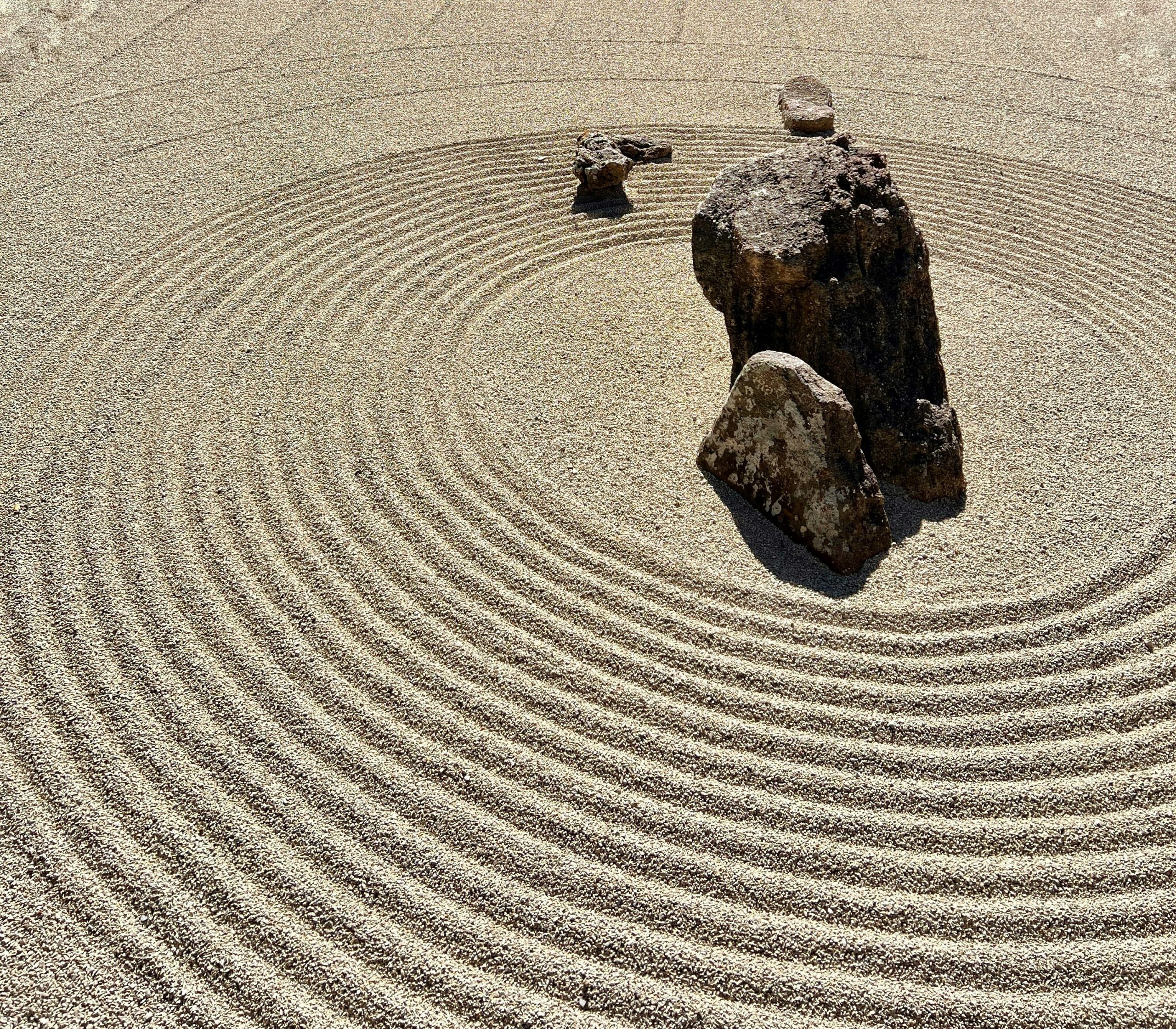 Spiral patterns on a beach - representing the cadent houses' function of organizing experience into meaningful patterns and finding order in life's constant flow