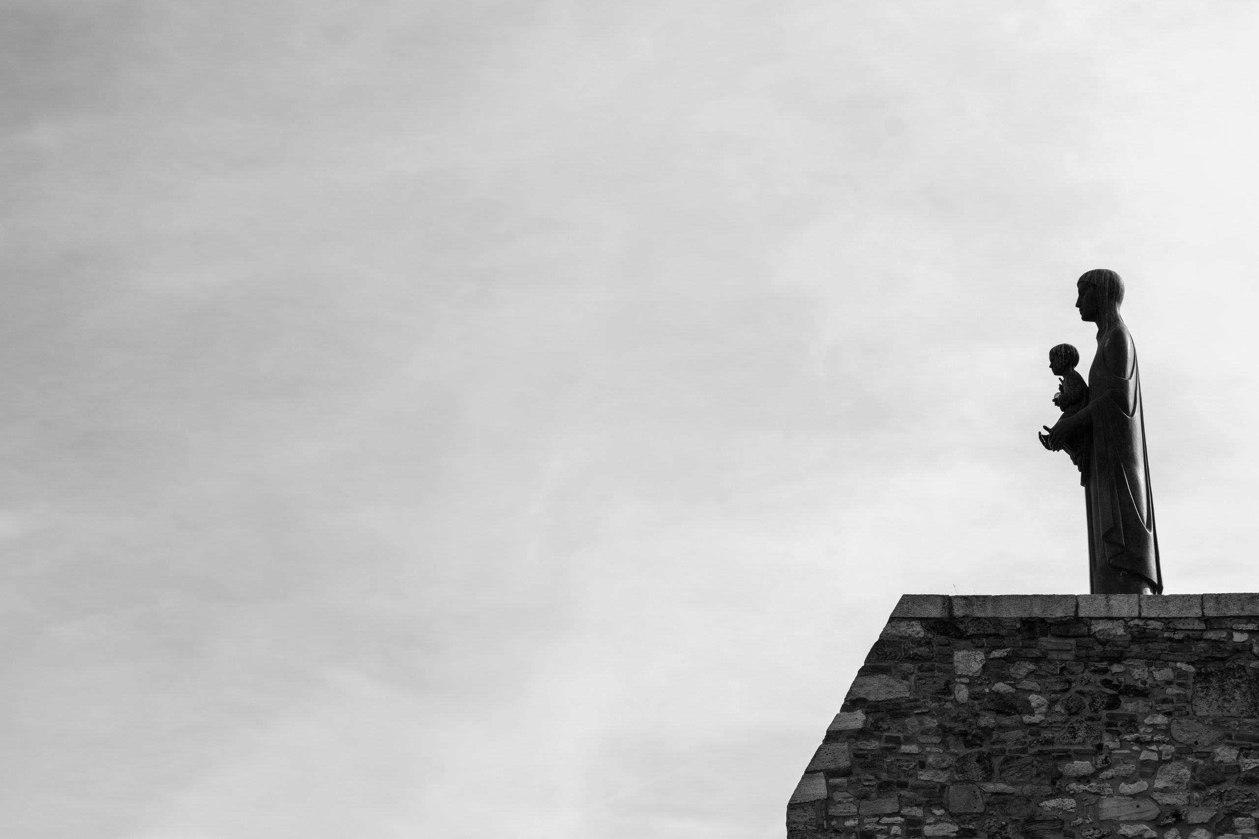 A father holding his child while standing on a rooftop at dawn, both facing eastward - representing the foundational stability and legacy-building themes of the succedent houses in astrological interpretation